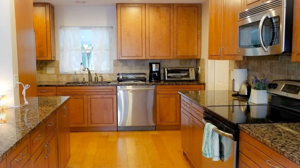 Large Kitchen with Stainless steel appliances and Granite counter tops