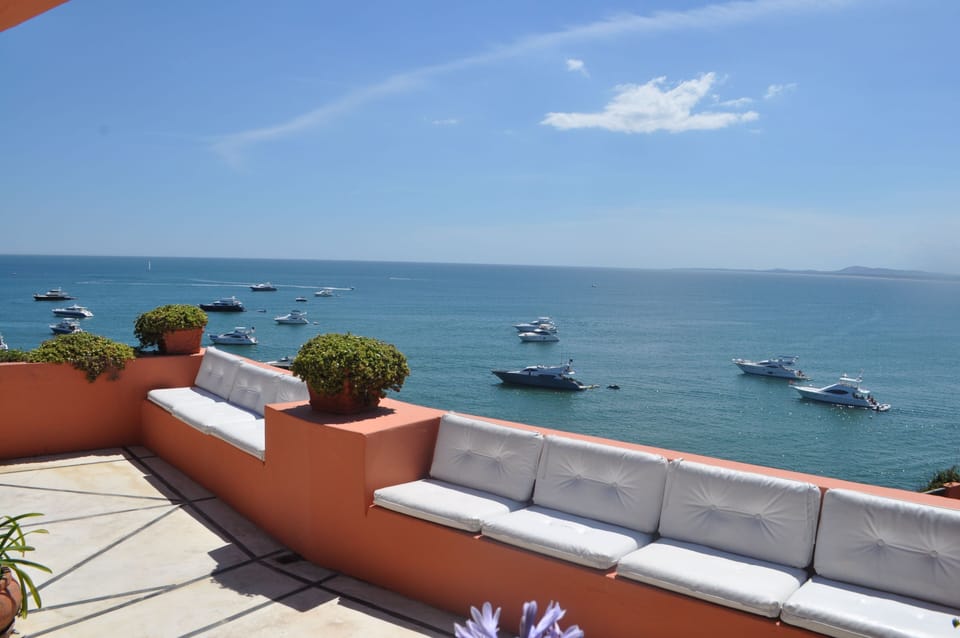 More seating on the upper terrace allows for yacht viewing or sunset toasting.