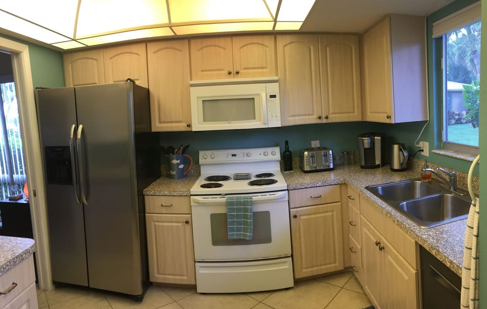Well applianced kitchen with direct access to dining/living area