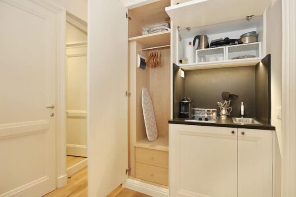 open cupboard and wardrobe with all the necessary elecrical appliances