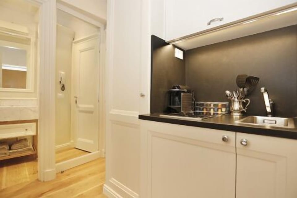 from the entrance view of the wardrobe and kitchenette with refrigerator