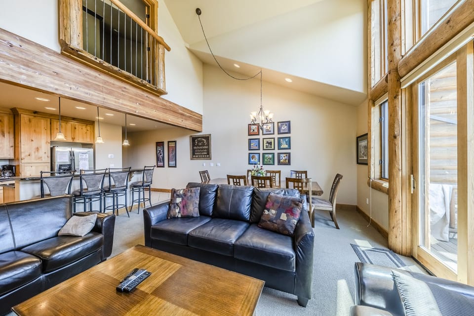 Living Area - Living area is ideally located within the open floor plan of the main level with easy access to the private balcony as well as the common areas of the home.