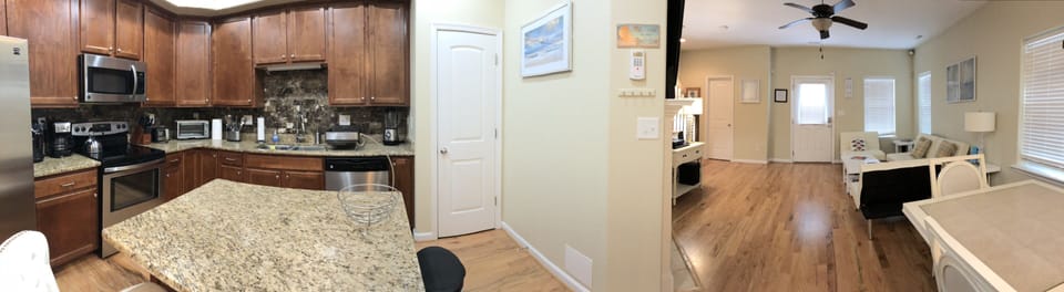Viewing of kitchen and living room.