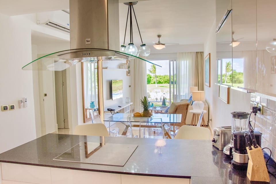 The beautiful view from the kitchen to the pool and golf course area