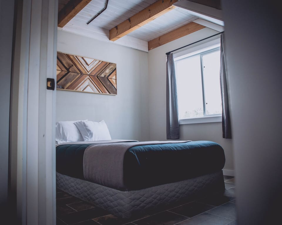 Main floor bedroom with queen bed.