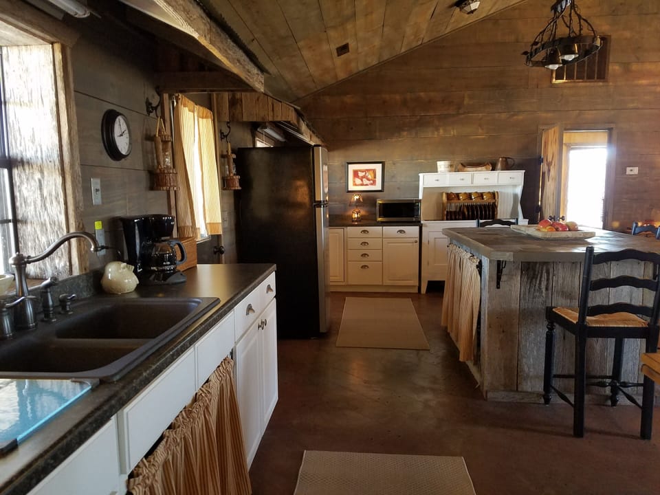 Washing dishes at the kitchen sink evokes the feel of country life.
