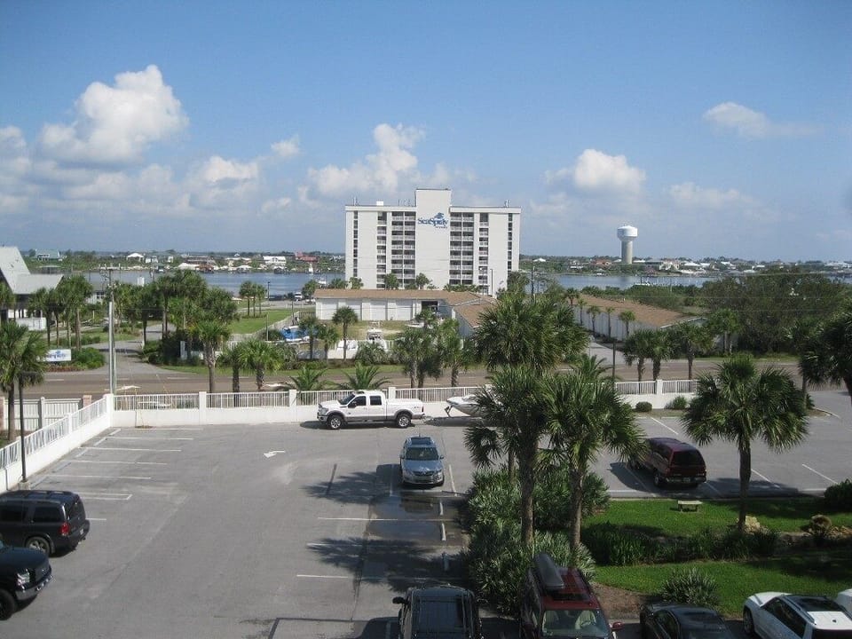View north, across highway, to SeaSpray's dockside unit, tennis courts and bay.