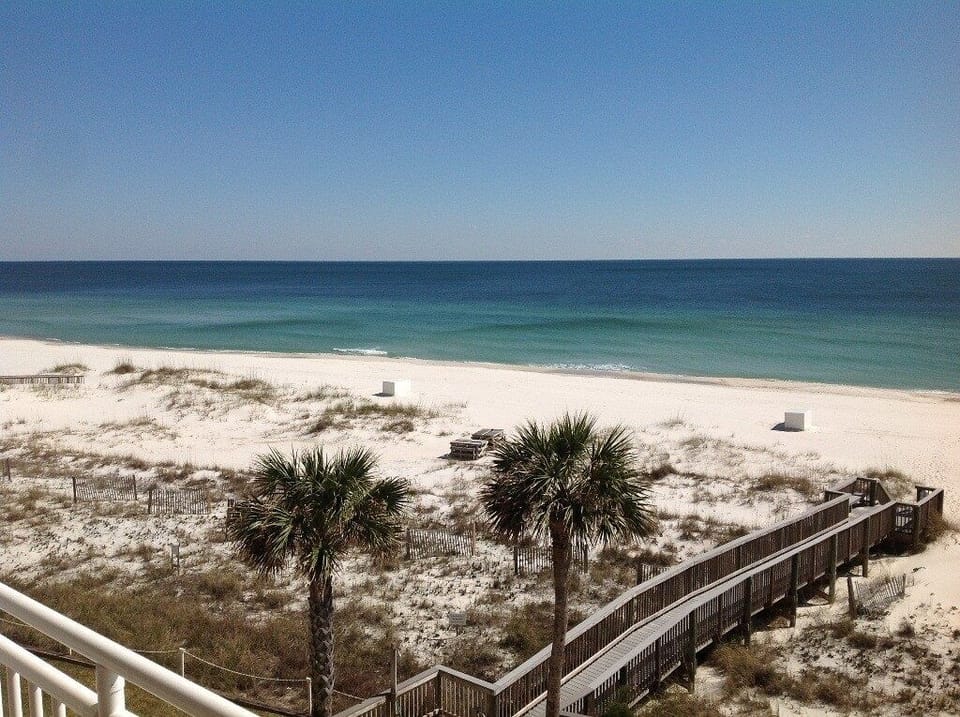 View from our balcony looking slightly east. Boardwalk to beach is just below!!