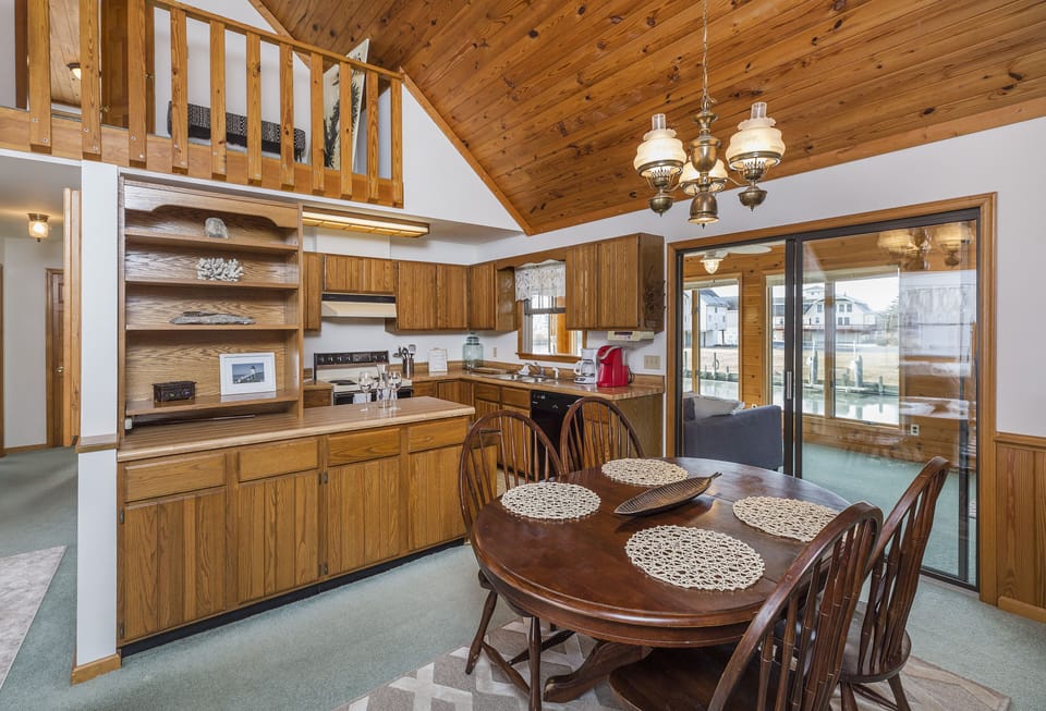 Lovely Dining Area is spacious & has awesome Canal Views.