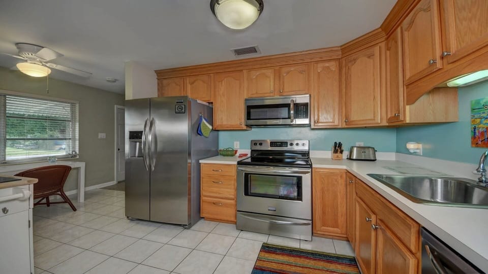 Kitchen with newer appliances and well equipped