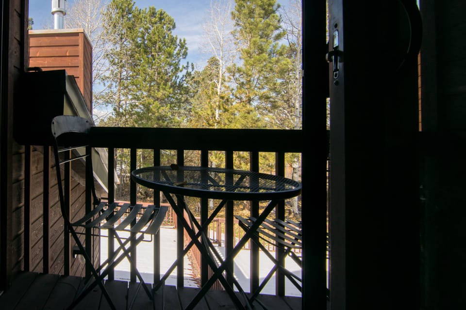 Private balcony with bistro table and chairs and beautiful view from guest room