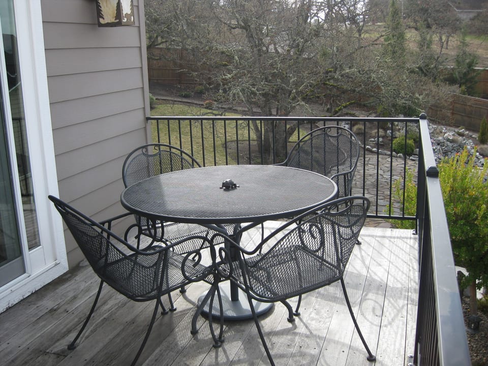 Grill steaks, enjoy a meal or watch the sunset on the large balcony/deck.