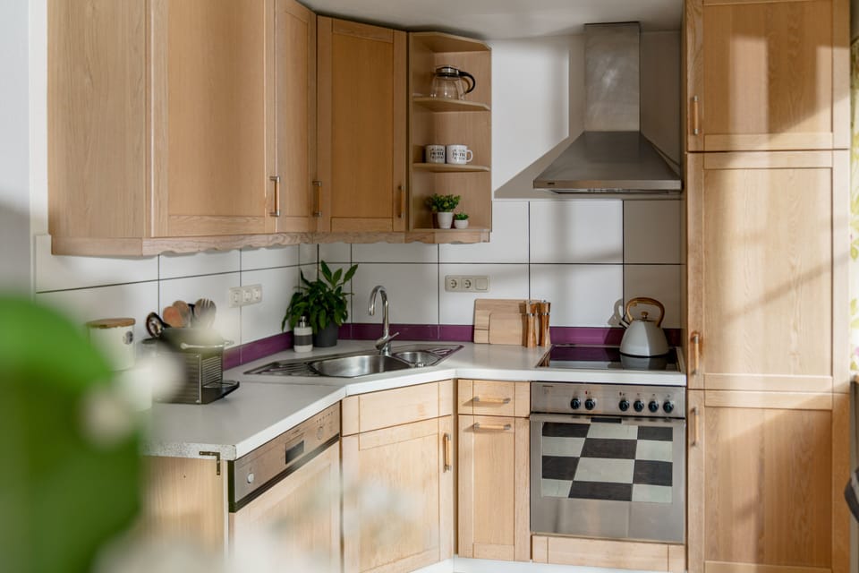 Kitchen with Nespresso coffee machine dishwasher, fridge/freezer, microwave