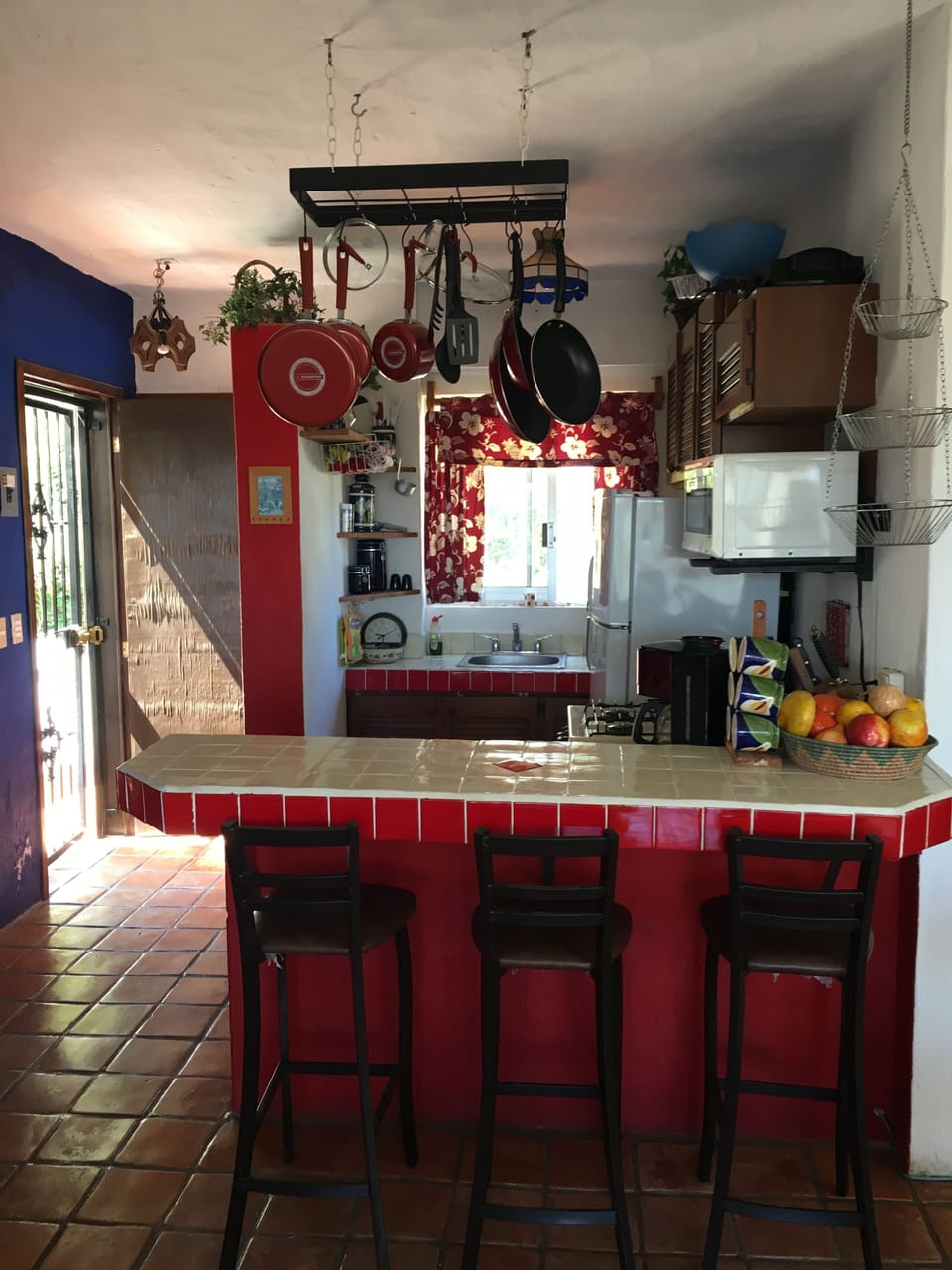 Full kitchen with oven, cooktop, fridge, microwave, pots, pans, utensils, etc..