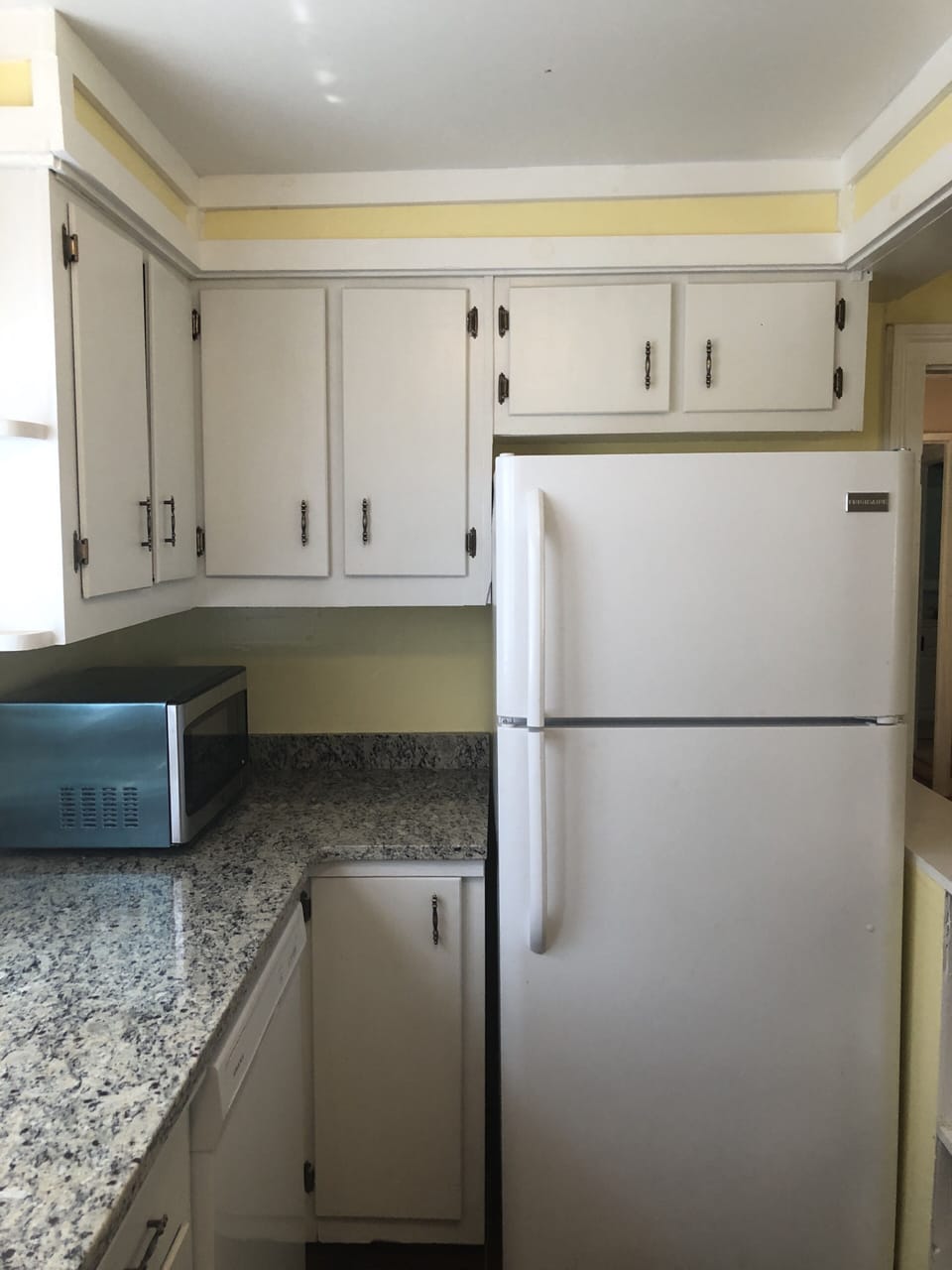 Kitchen with granite countertop.
