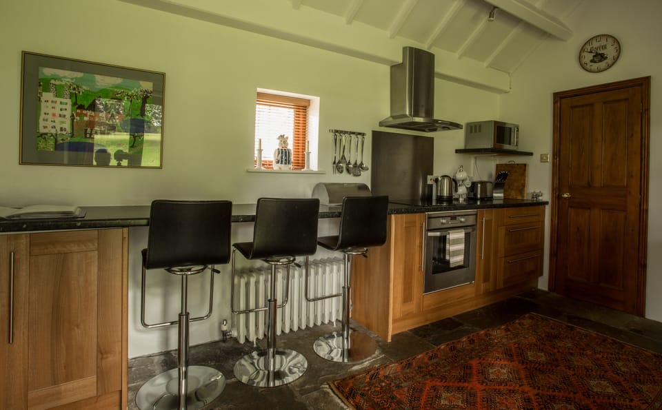 Kitchen with a breakfast bar. Utility room at the end of the kitchen