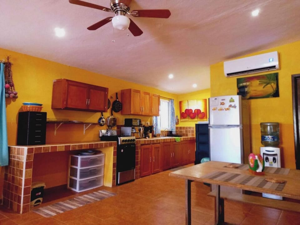 Fully equipped kitchen features propane stove/oven, microwave, blender and more.