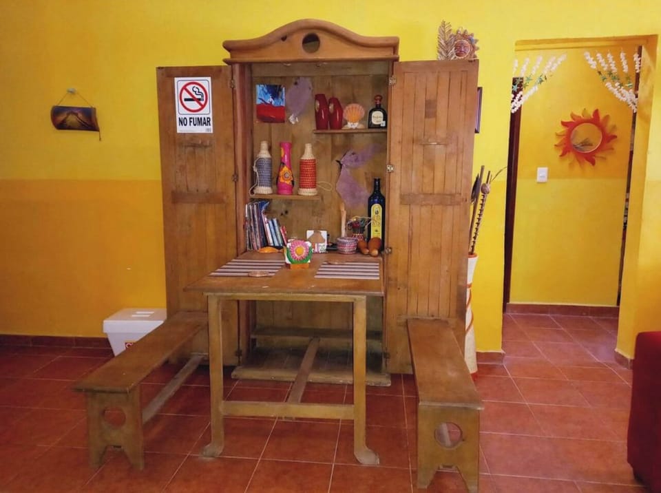 Solid hardwood fold up dining hutch seats four comfortably. 