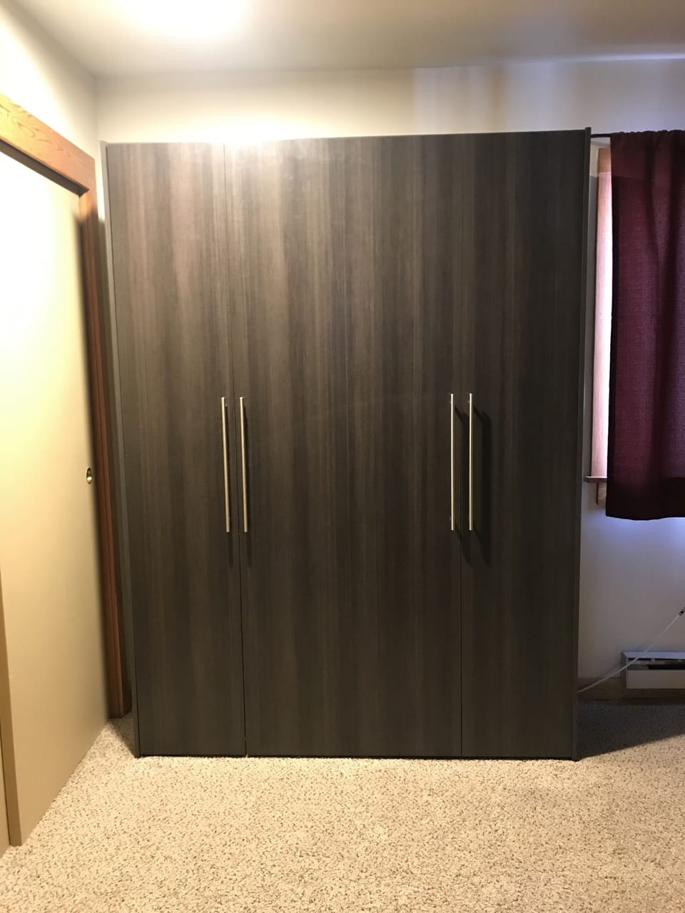 Full-sized murphy bed in master bedroom.
