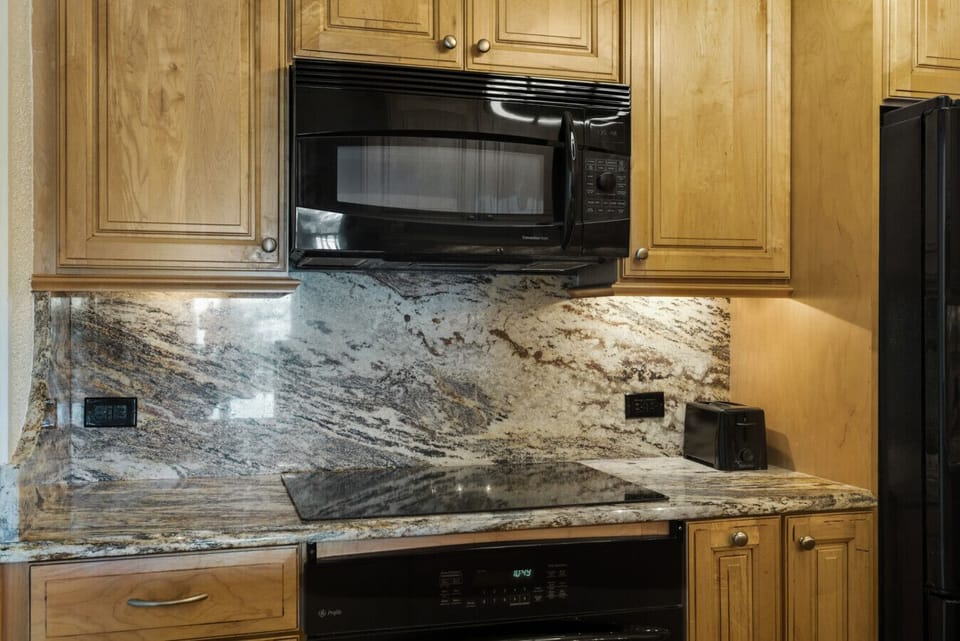 Fully equipped kitchen with modern appliances.