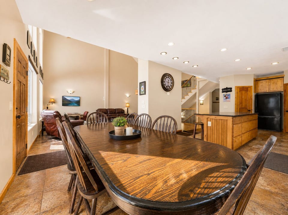 Gather around the spacious dining table where laughter flows freely, then sink into plush leather sofas. Warm wood tones and natural light create the perfect setting for your group getaway.