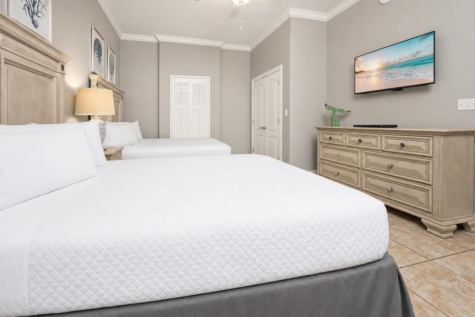 Unwind in this queen guest suite and stream your favorite shows or enjoy a good movie after a beach day