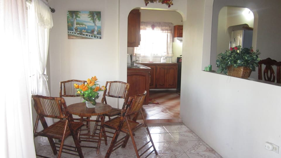 view capturing family room, kitchen and dining areas. Great area to relax