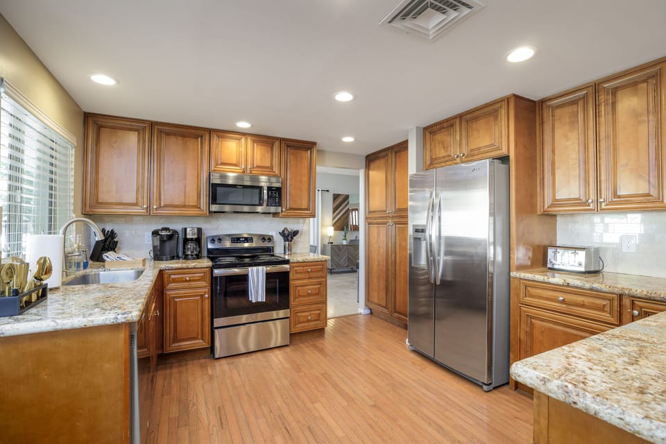 Spacious kitchen with solid wood cabinets.