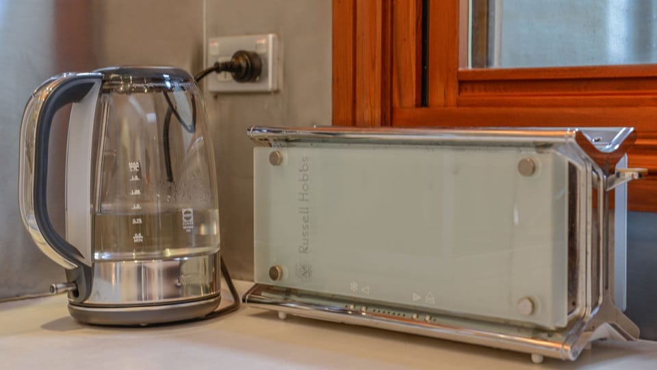Appliances include kettle, toaster, microwave, cooktop and oven, and more.