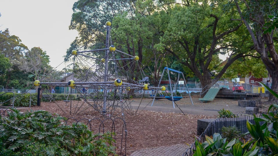 Playground adjoining in the park across the street.