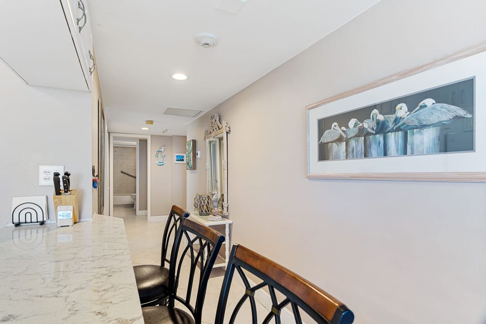 Kitchen area looking towards entrance of unit