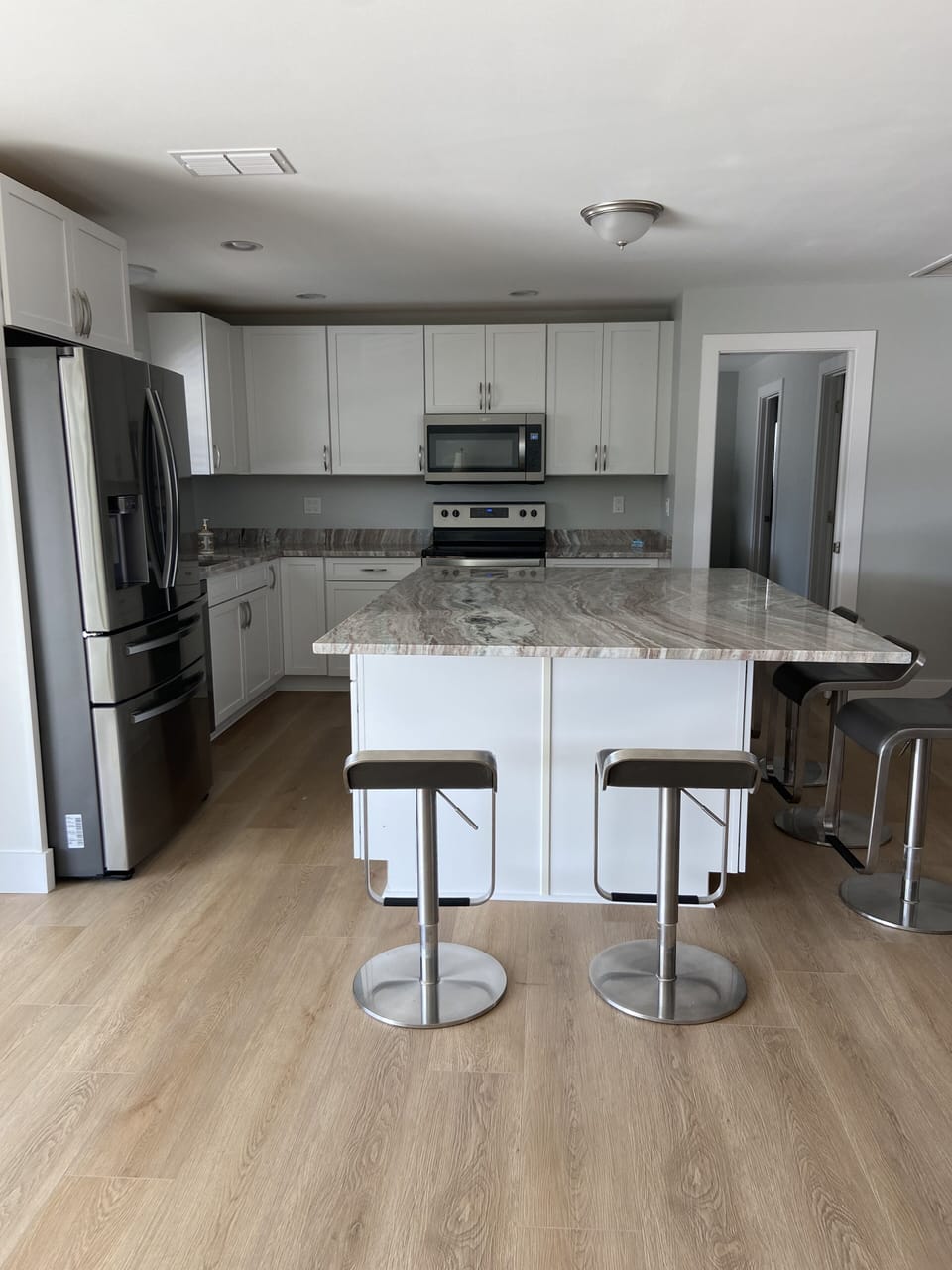 Large kitchen with new appliances. 