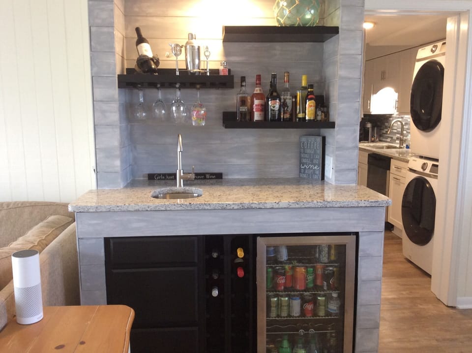 New Wet Bar with sink and Beverage Refrigerator and Wine Rack. 