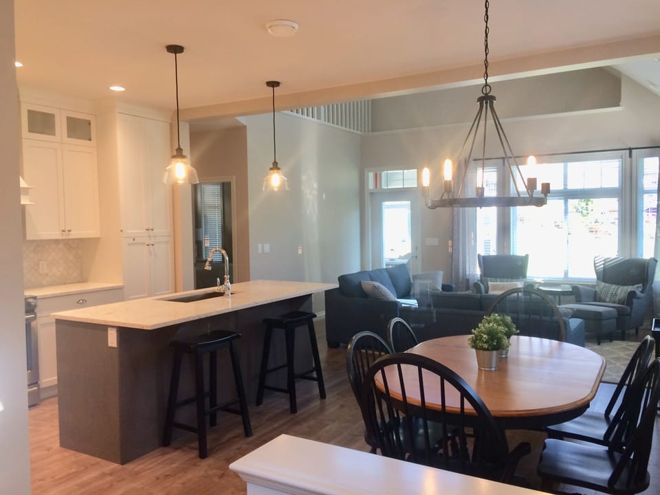 Open concept kitchen, dining and living room . 