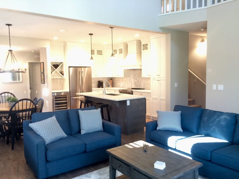 two story living room makes the home light and airy.