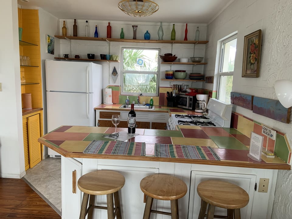 Closer look of the kitchen and kitchen counter. 