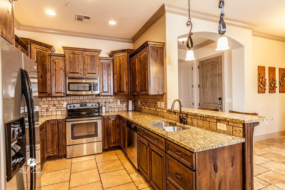 Fully stocked kitchen with table settings for 10