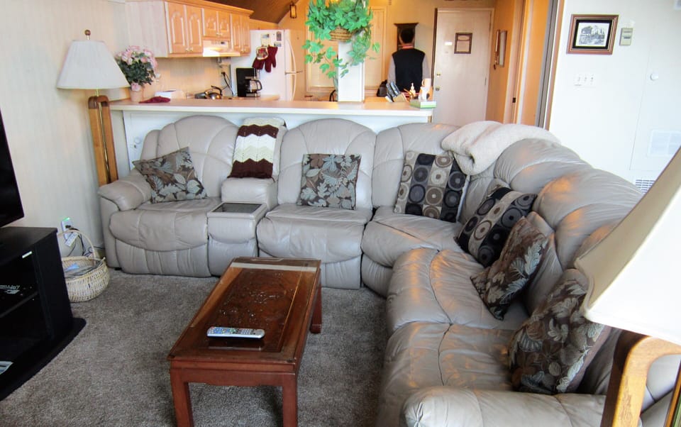 Large L shaped leather sofa with sofa bed.

