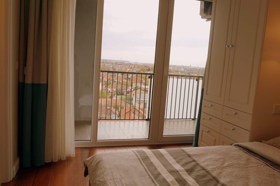 Master bedroom with french doors to the second balcony