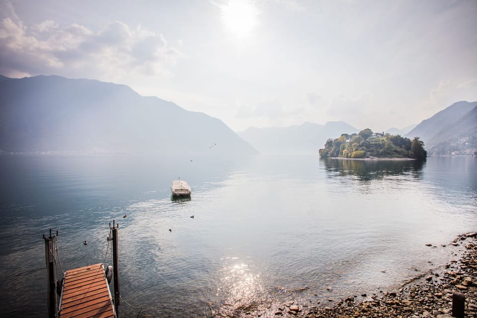 The lake, boat mooring and shingle beach here at "Darsena Ossuccio" 