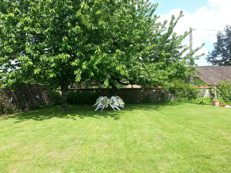 The rear lawns of the main property offer space and shelter to relax.
