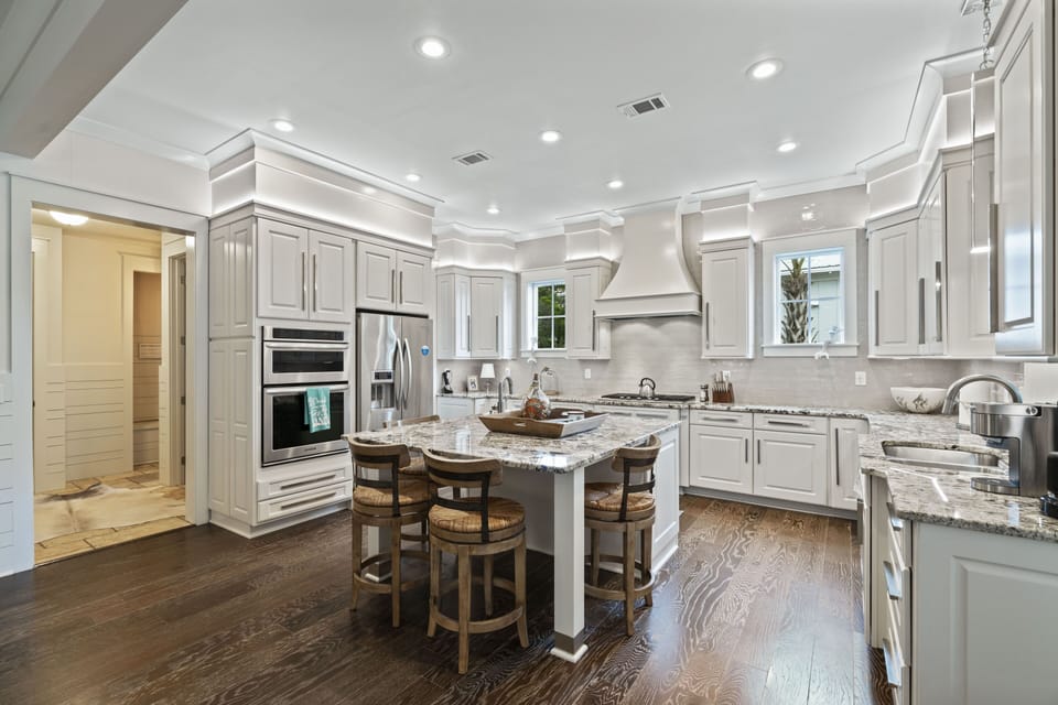 Kitchen showing entry from carport / mudroom / main level laundry room.