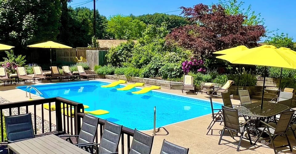 BACKYARD:pool, hot tub, privacy fence (pet proof), grill, dining for 24, firepit