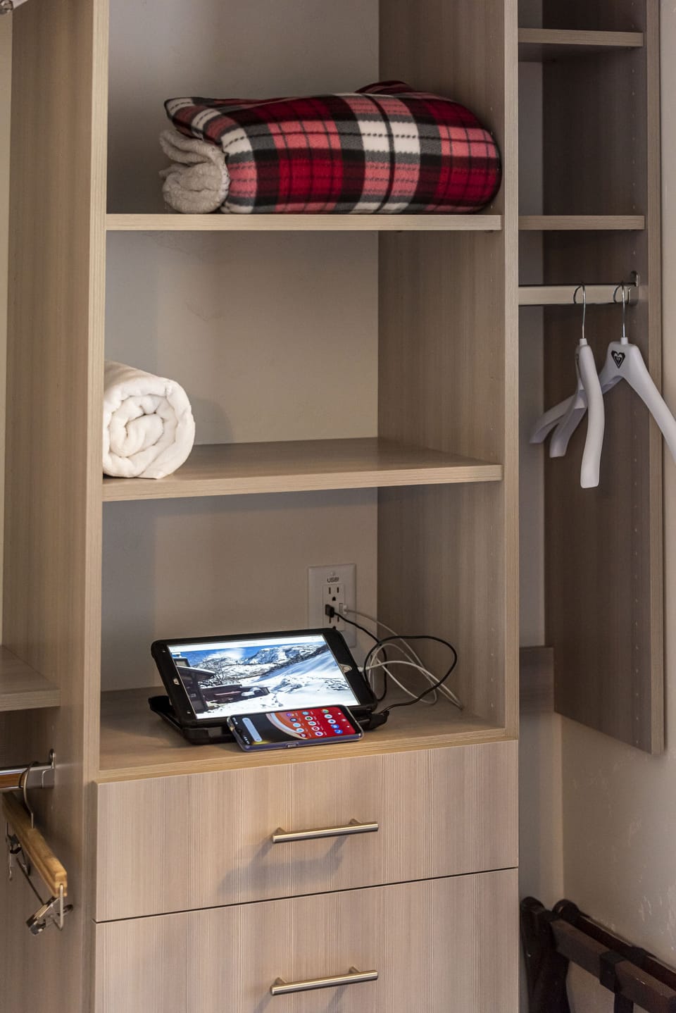 Power outlets and two USB ports on shelf in each bedroom closet
