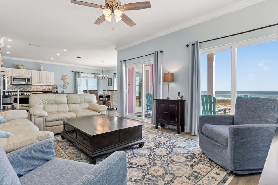 
First-floor den: 75" Smart TV, leather seating with Gulf views.