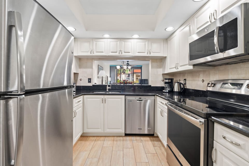 Modern kitchen, full equipped,stainless steel appliances & granite counters.