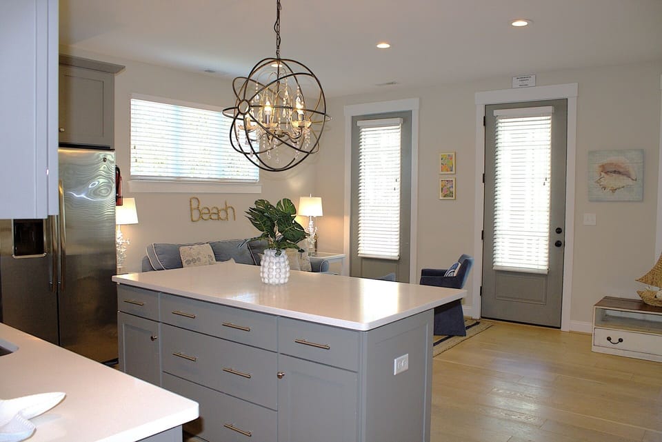 A decorative pendant light hangs over the island, adding elegance to the space.