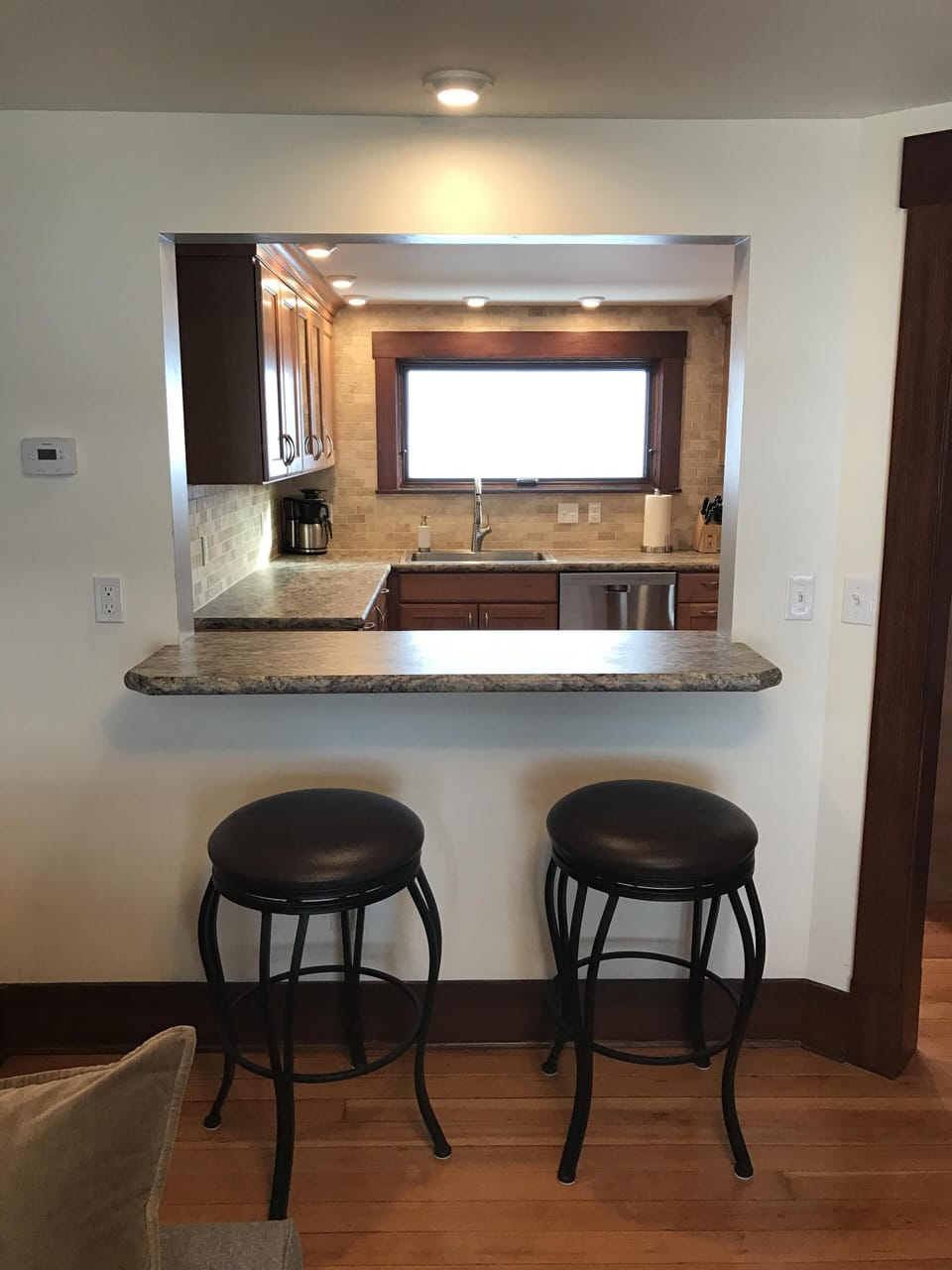 breakfast bar with line of sight from living room to kitchen.