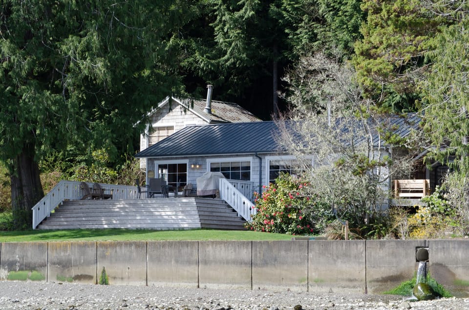 In the background is an upper bedroom that is blocked off due to unsafe  stairs.