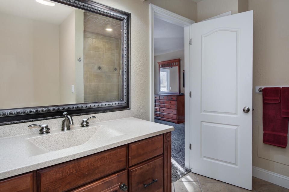 Sink features solid surface integrated sink and extended vanity
